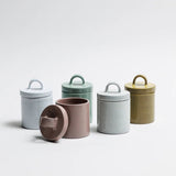 Ochre Italian ceramic canister styled on a kitchen shelf