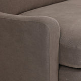 Close-up of Broadway Coffee 100% flax linen upholstery on the Aurelia sectional, showing the deep coffee brown weave and reversible boxed cushion casing