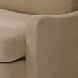 Close-up of Broadway Canvas 100% flax linen upholstery on the Aurelia sectional, showing the natural off-white weave and reversible boxed cushion casing