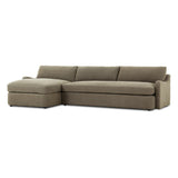 Amber Lewis x Four Hands Aurelia sectional in Broadway Olive linen styled in a living room, left-facing chaise extended across a 128-inch span