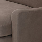 Close-up of Broadway Coffee 100% flax linen upholstery on the Aurelia sectional, showing the deep coffee brown weave and reversible boxed cushion casing