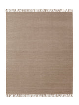 Armadillo Willow Rug in Kiln, a second view of the handwoven flatweave rug in a styled interior