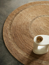 Petunia Rug by Armadillo, hand-braided jute rug, styled in a room at Calimia Home
