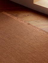 Armadillo Willow Rug in Henna, detail of the linen, wool, and jute weave and texture