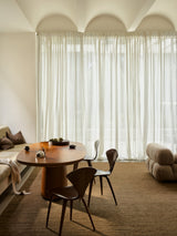 Armadillo Latitude Rug in Caramel, handwoven linen flatweave rug shown in a room setting
