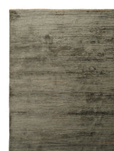 Armadillo Staccato Rug in Olivine, corner close-up of the silk, linen, and cotton pile and edge