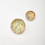 Two-piece Etrusca Verde oil and salt dish set styled on a table