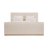 Calimia Home Bennett Bed in off-white Belgian linen with vertical channel tufting and a natural oak base.