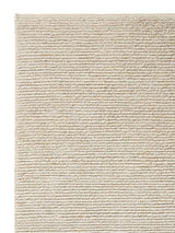 Armadillo Palermo Rug in Bone, corner close-up of the linen, wool, and cotton pile and edge