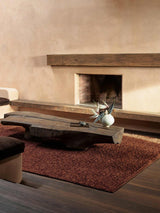 Armadillo Mason Rug in Sangria, handwoven new zealand wool rug shown in a room setting