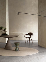 Armadillo Braid Rug in Mushroom, hand-braided wool blend rug shown in a room setting