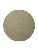 Armadillo Braid Rug in Oregano, a second view of the hand-braided wool blend rug in a styled interior