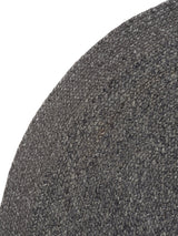 Armadillo Braid Rug in Charcoal, corner close-up of the wool and viscose blend pile and edge
