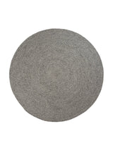 Armadillo Braid Rug in Pumice, overhead view of the hand-braided wool blend weave and edge finish