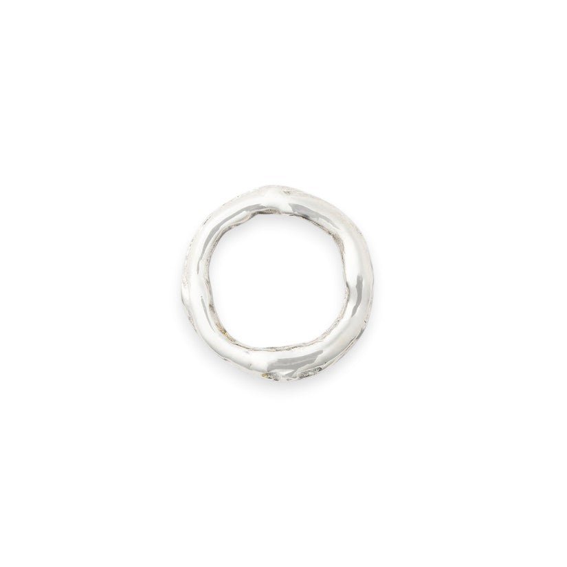 Calimia Home branch-inspired silver-toned napkin ring with a textured, organic sculptural design.