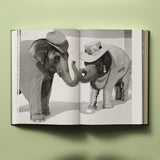 Calimia Home Bruce Weber My Education book open to a spread showing two dressed-up elephant figures in black and white.