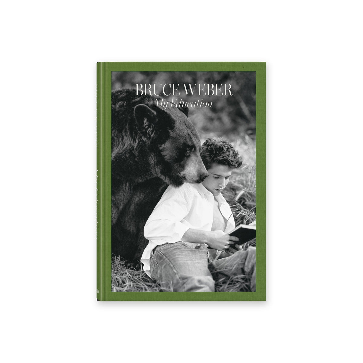 Calimia Home Bruce Weber My Education book from Taschen, green cloth cover with a black and white photograph of a young man reading beside a bear.
