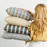 Walter G Buzios Desert decorative pillows with patterned fabric, hidden zippers, and feather inserts