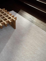 Armadillo Thatch Rug in Dew, a second view of the hand-knotted wool rug in a styled interior