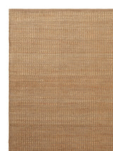 Armadillo Reed Rug in Natural, corner close-up of the jute with a wool weft pile and edge