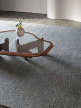 Armadillo Corsica Rug in Indigo, handwoven wool and linen rug shown in a room setting