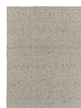 Armadillo Winnow Rug in Granite, corner close-up of the wool pile and edge