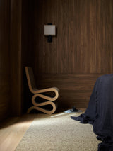 Armadillo Pebble Rug in Gravel, a second view of the handwoven boucle wool rug in a styled interior