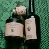 Flamingo Estate Chef's Kiss Gift Set styled on linen with fresh herbs