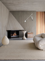 Armadillo Cable Rug in Calico, handwoven soumak wool rug shown in a room setting