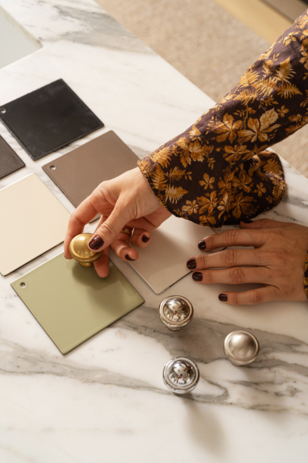 Comparing Lacanche range knob finishes at the Calimia Home showroom in Coral Gables