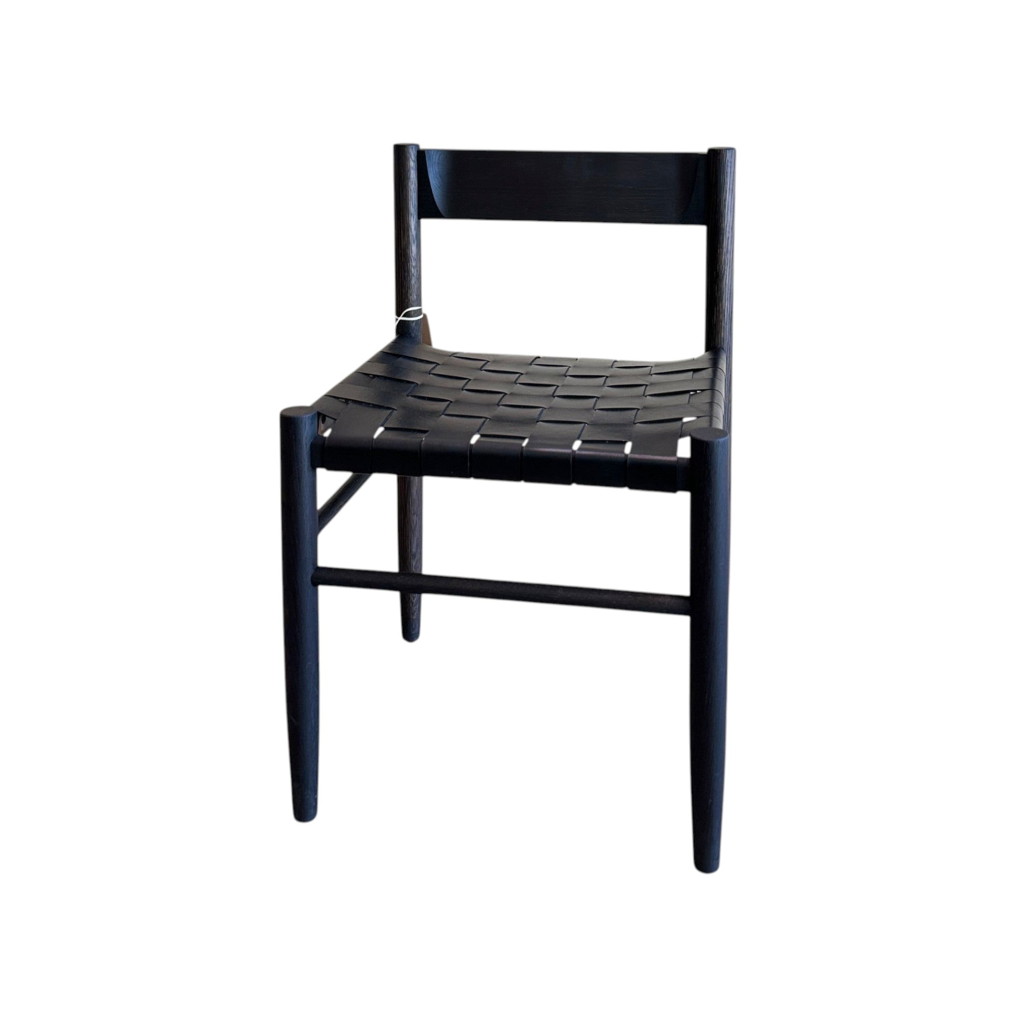 Calimia Home Gaon chair featuring a sculptural black oak frame and a woven black leather seat in a modern style.