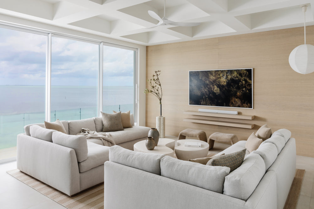 Serene coastal living room with plush white sectionals and ocean views in the Peaceful Waters home, Islamorada