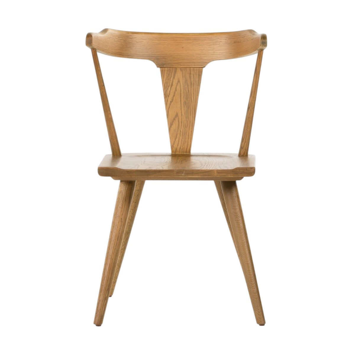Calimia Home Ripley dining chair in sandy oak with a sculptural mid-century Windsor design and natural wood grain.