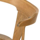 Calimia Home Ripley dining chair in sandy oak with a sculptural mid-century Windsor design and visible wood grain.