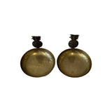 Vintage brass pineapple dishes from above showing polished gold interiors and darkened bronze finials