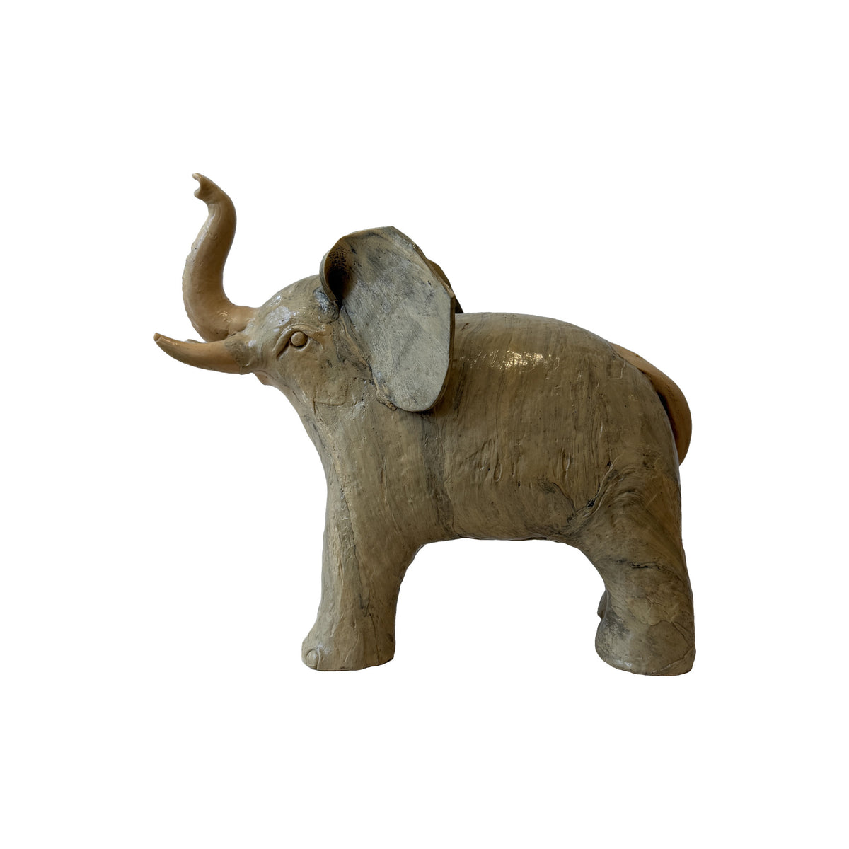 Vintage carved wood elephant in profile, trunk raised, pale limed finish worn to bare wood across the flanks and legs