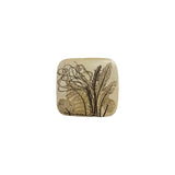 Vintage ceramic botanical wall tile with a broad fern frond, dock leaves and ribboning grasses pressed into speckled cream stoneware