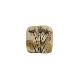 Vintage ceramic botanical wall tile with Queen Anne's lace and scalloped geranium leaves pressed into speckled cream stoneware, signed by the maker