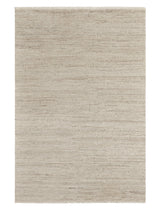Armadillo Camino Rug in Sawdust, a second view of the cut pile undyed wool rug in a styled interior