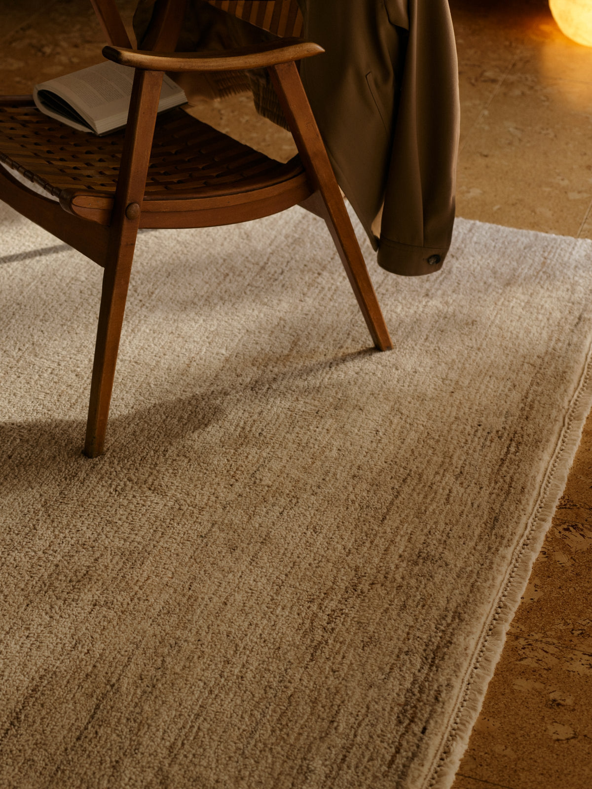 Camino Rug by Armadillo, cut pile undyed wool rug, styled in a room at Calimia Home
