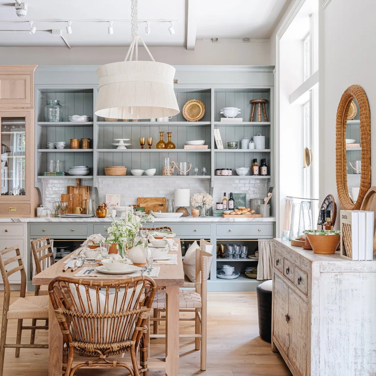 Calimia Home showroom kitchen with the Cassidy Chandelier, oak dining table and Reedition Breakfast Buffet