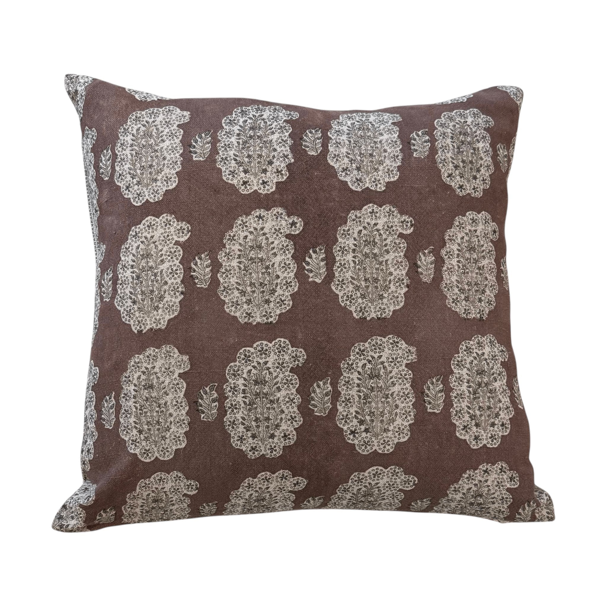 Filling Spaces Cefalu Coco pillow with a brown and neutral hand-block-printed paisley motif on textured fabric.