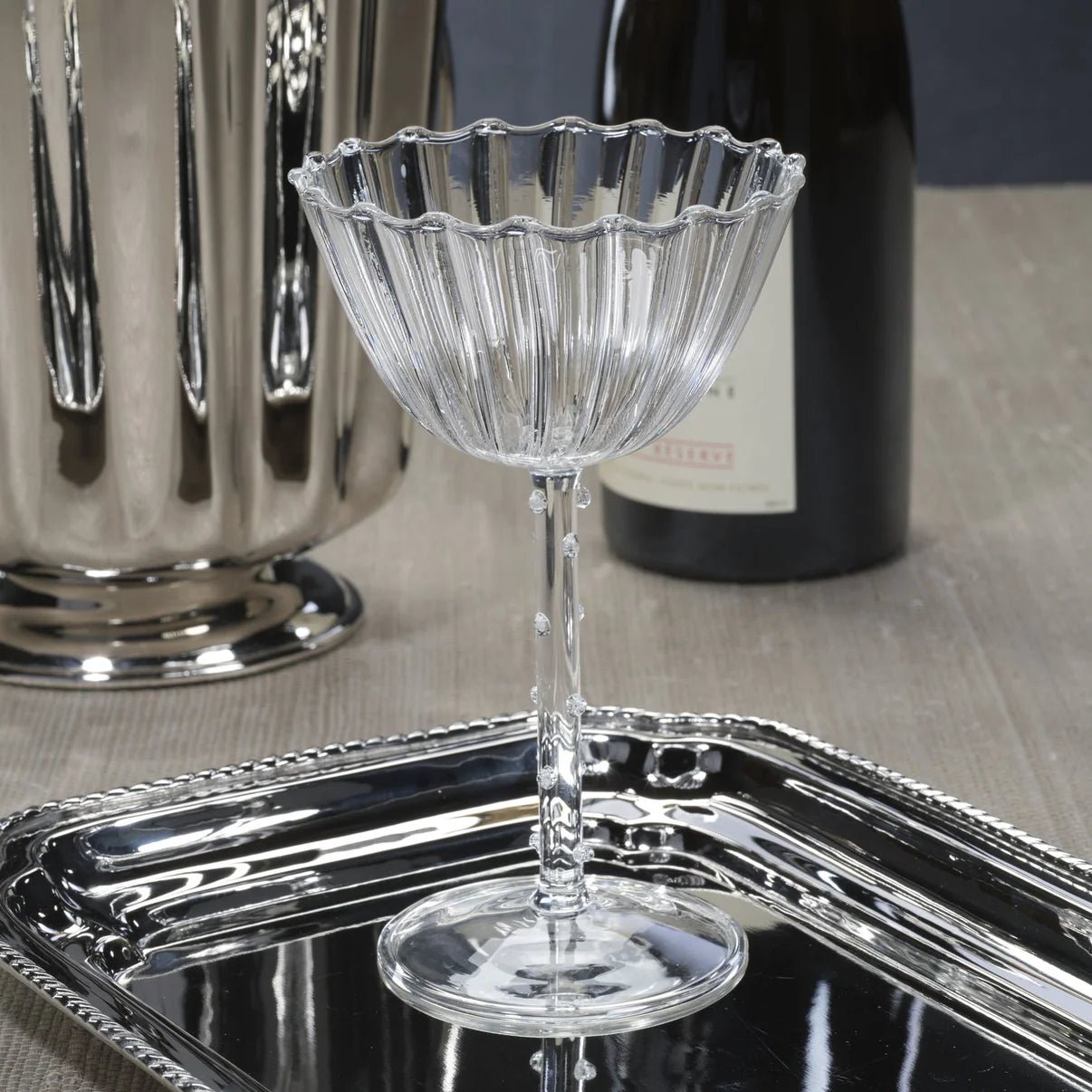 Chamont Coupe Glass lifestyle shot showing ribbed bowl and slender stem