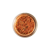 Calicutts Chipotle & Honey spice blend in a glass jar, featuring a vibrant orange-red seasoning mix.