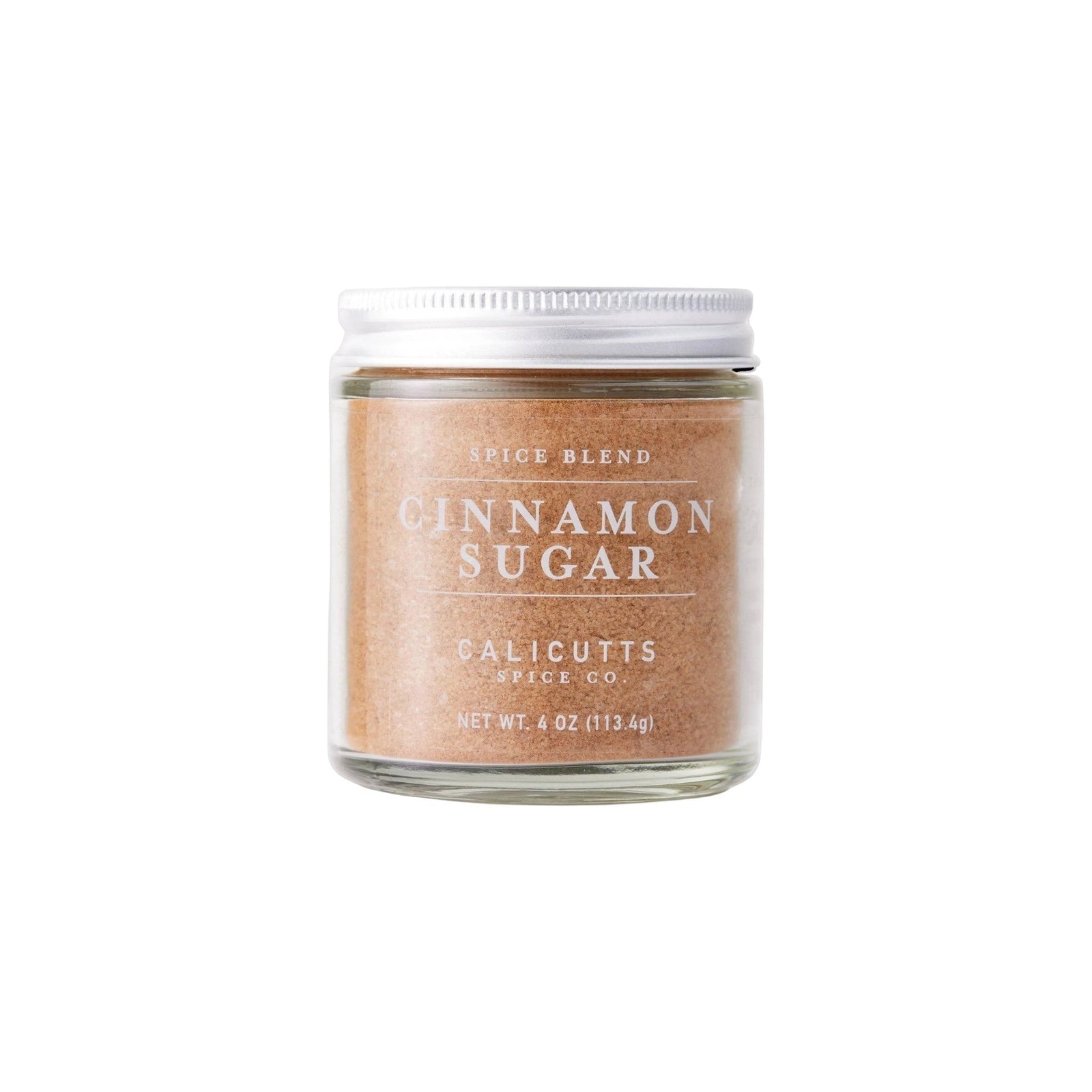 Calicutts Cinnamon Sugar spice blend in a 4 oz glass jar with a white lid against a white background.