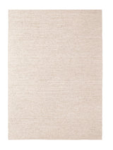 Armadillo Cirrus Rug in Salt, a second view of the hand-knotted wool rug in a styled interior