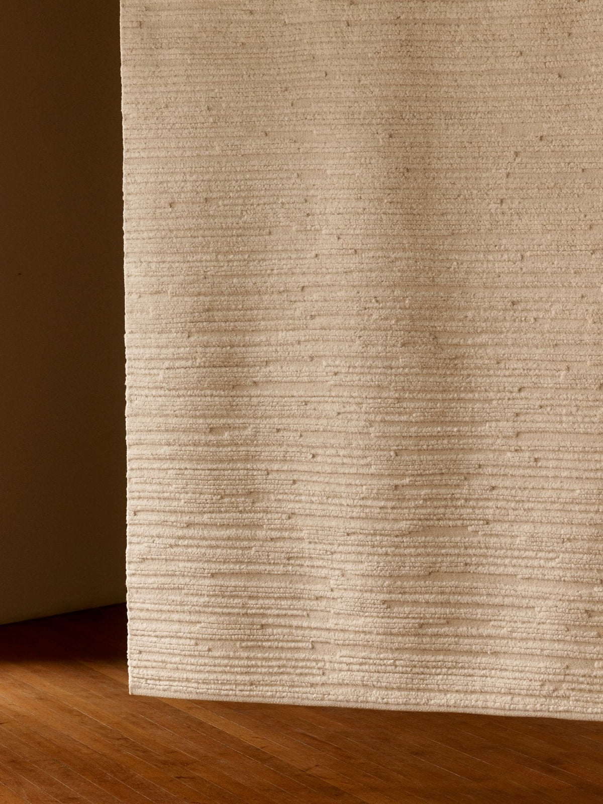 Armadillo Cirrus Rug in Salt, hand-knotted wool rug shown in a room setting