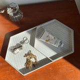 Large Clémence hexagon tray holding rings, a gold bracelet and hand cream on a sunlit wooden table
