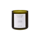 Flamingo Estate Tuscan Rosemary scented candle in a forest-green glass jar with a white label.