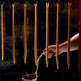 Pair of natural beeswax taper candles styled on a table